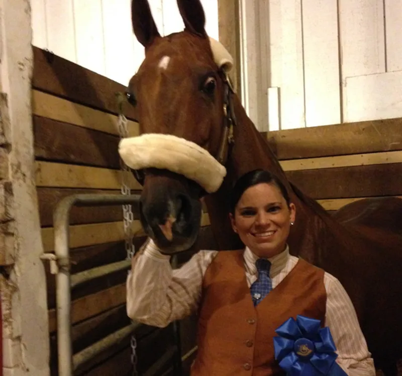 Sarah after winning a blue ribbon with a young horse